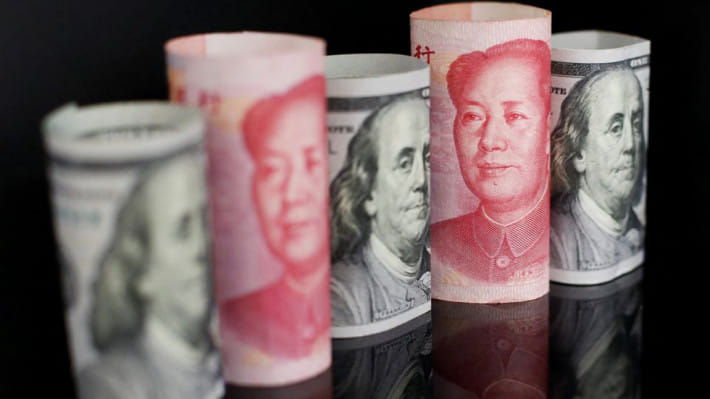 মার্কিন ডলার ও চীনের ইউয়ান। ছবি: রয়টার্স