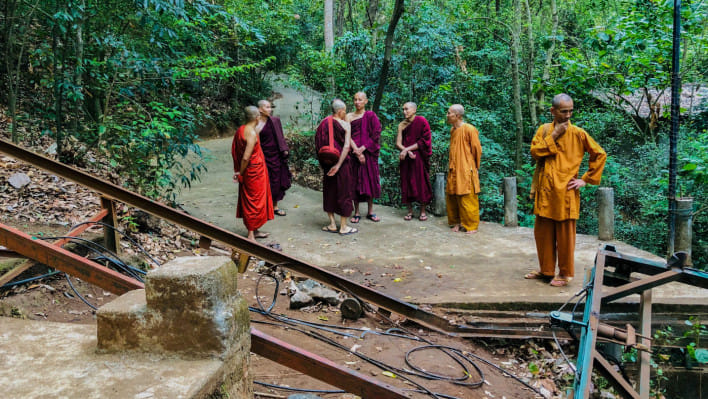 বৌদ্ধ ভিক্ষুরা দুর্ঘটনাস্থল পরিদর্শন করছেন। ছবি: এএফপি