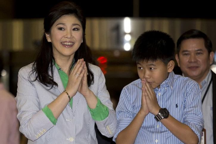 Yingluck Shinawatra and son Supasek Amornchat Yingluck Shinawatra and son Supasek Amornchat