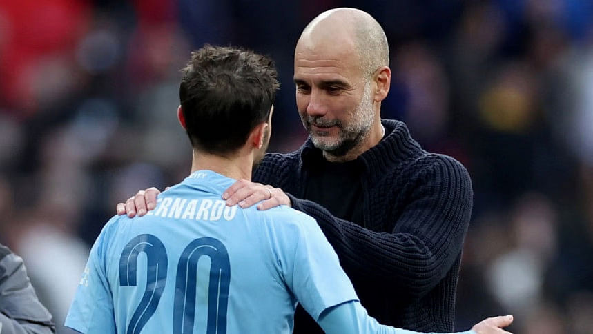 Pep Guardiola celebrates with Bernardo Silva Pep Guardiola celebrates with Bernardo Silva